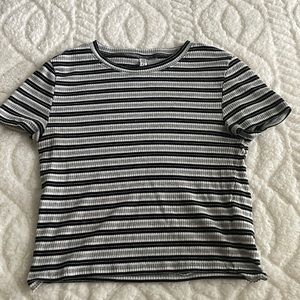 Crop top, Size is a “M” and color is black, white and grey